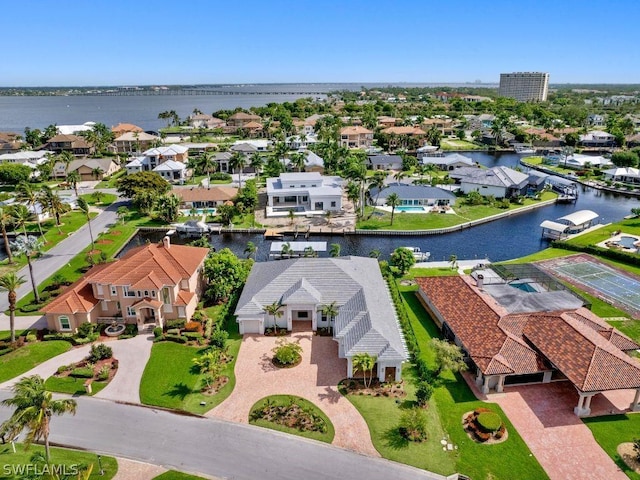 birds eye view of property with a water view