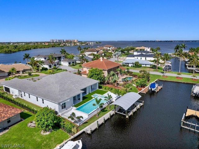 drone / aerial view featuring a water view