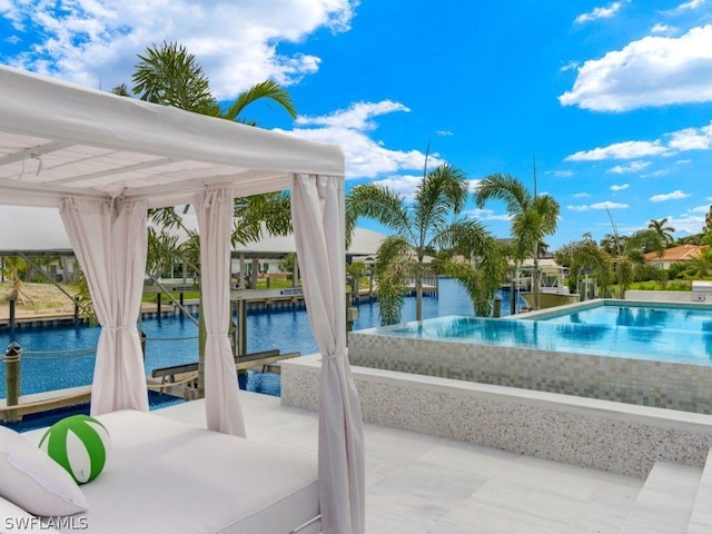 view of pool with a water view