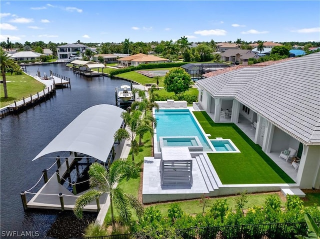 birds eye view of property with a water view