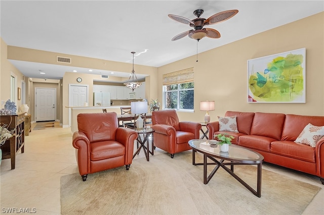 living room with light tile patterned floors and ceiling fan