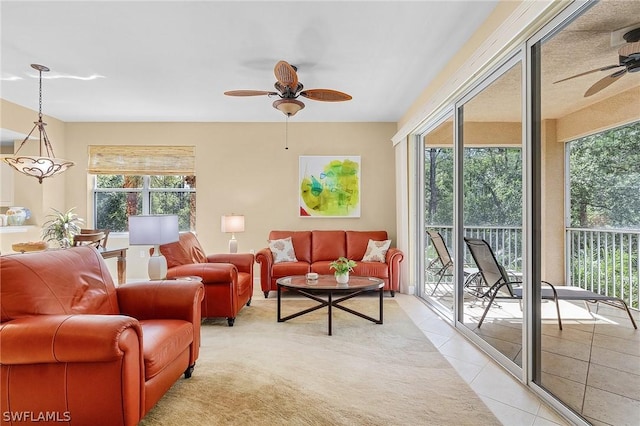 sunroom / solarium featuring ceiling fan