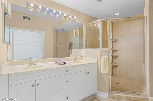 bathroom with vanity and walk in shower