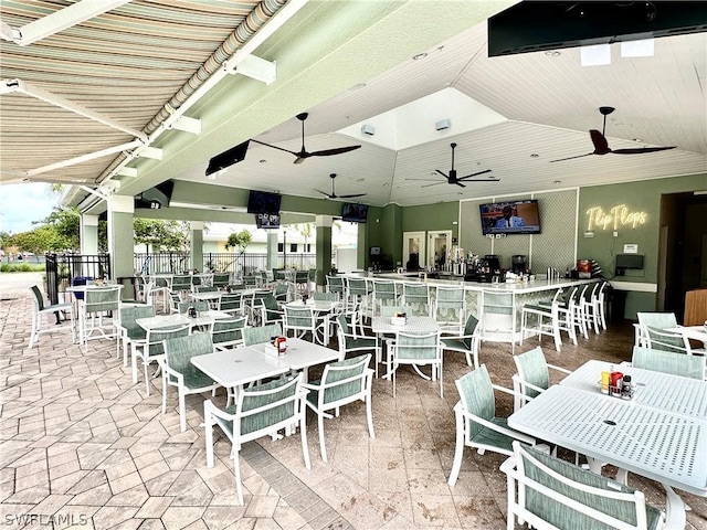 dining area featuring ceiling fan and vaulted ceiling