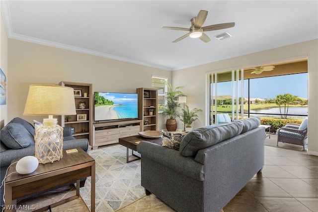 living room with ceiling fan, crown molding, and tile patterned flooring