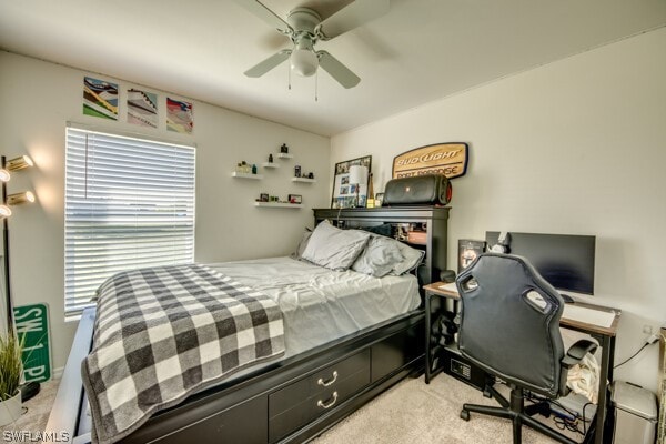 bedroom featuring light carpet and ceiling fan