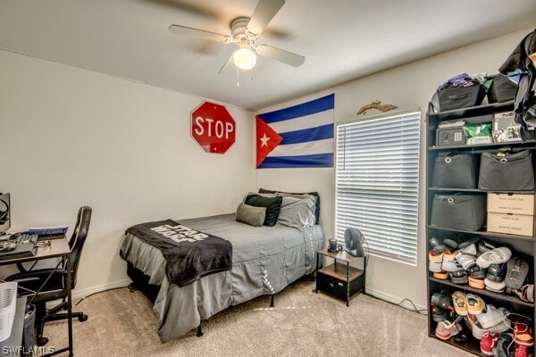 carpeted bedroom featuring ceiling fan