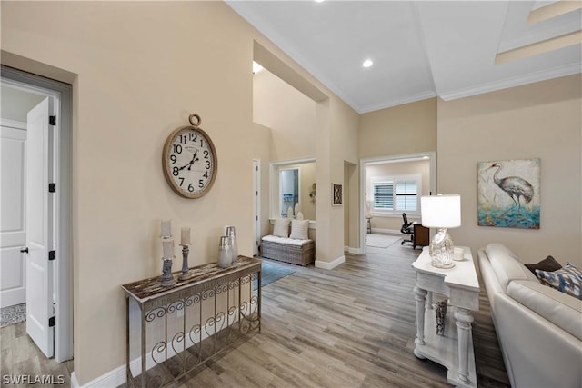 interior space with ornamental molding and light wood-type flooring