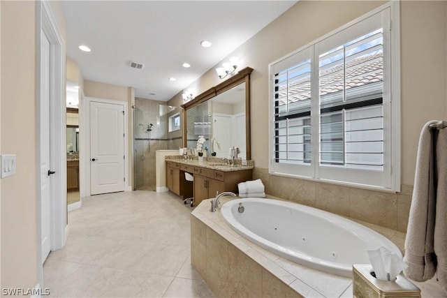 bathroom with vanity, tile patterned floors, and independent shower and bath