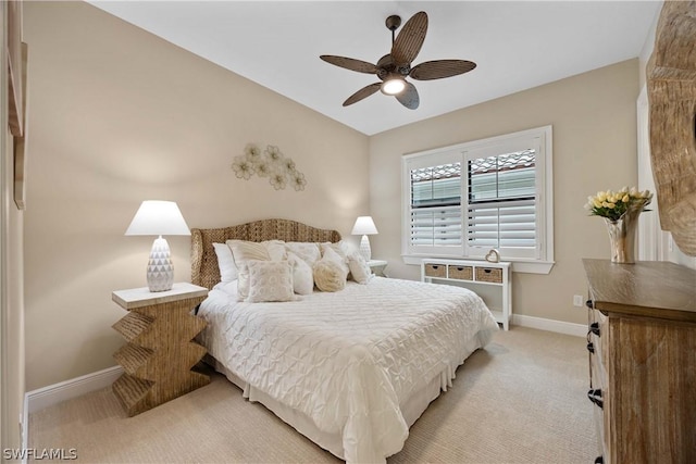 carpeted bedroom with lofted ceiling and ceiling fan