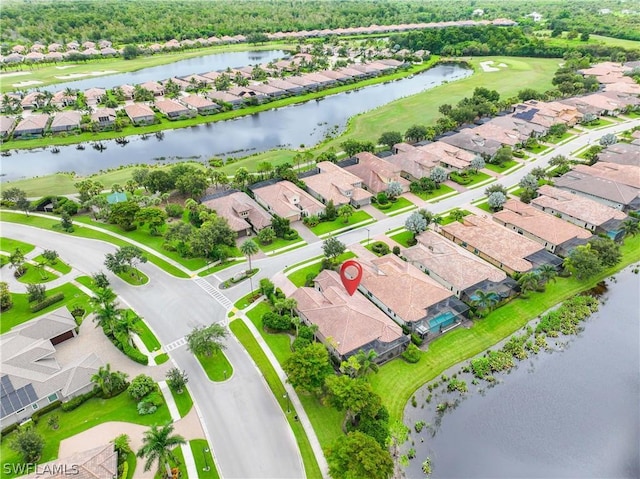 drone / aerial view with a water view