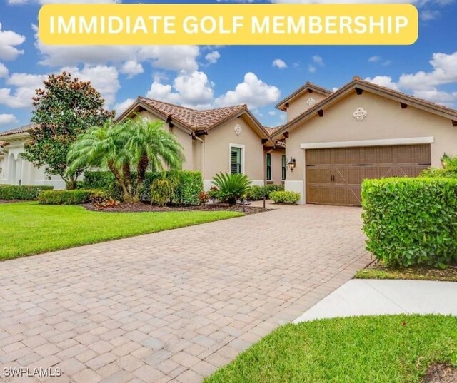 mediterranean / spanish-style home featuring a garage and a front lawn