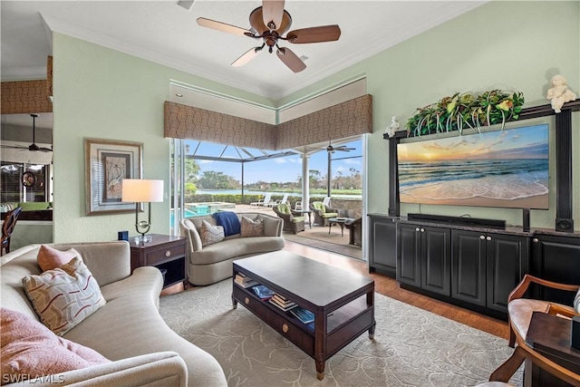 living room with a sunroom, ceiling fan, and ornamental molding