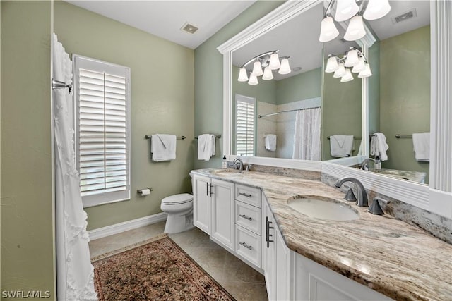 bathroom featuring curtained shower, tile patterned flooring, toilet, a sink, and visible vents