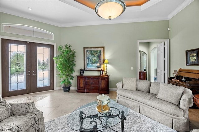 living area with arched walkways, baseboards, french doors, ornamental molding, and tile patterned floors