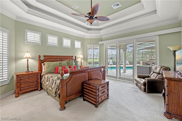 bedroom featuring light colored carpet, visible vents, access to outside, a raised ceiling, and crown molding