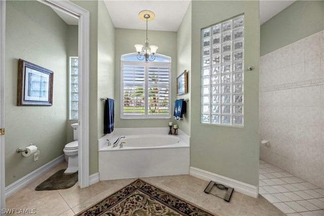 bathroom featuring toilet, a garden tub, tile patterned flooring, an inviting chandelier, and a walk in shower