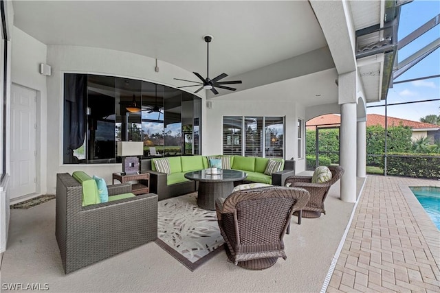 view of patio with an outdoor hangout area, ceiling fan, a lanai, and an outdoor pool