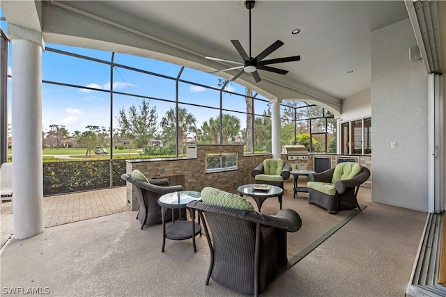 sunroom featuring a ceiling fan