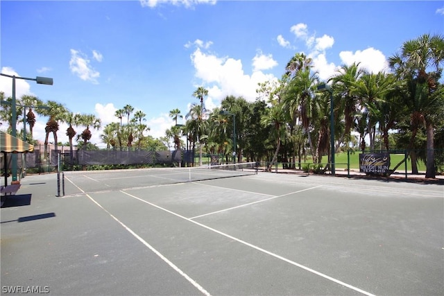 view of sport court with fence