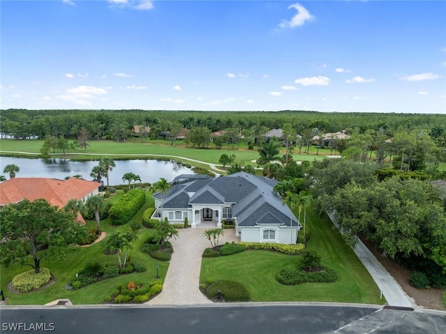 birds eye view of property with a water view