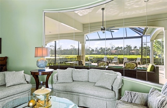 interior space featuring a ceiling fan and a sunroom