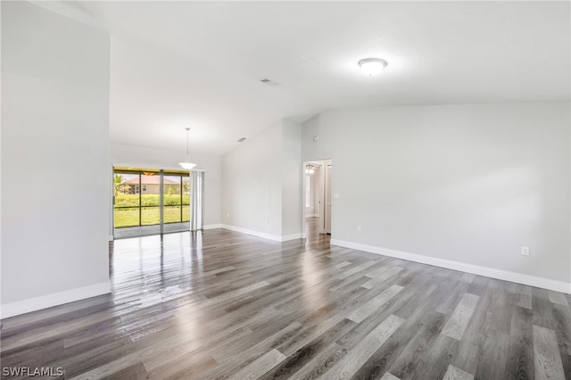 unfurnished living room with high vaulted ceiling and hardwood / wood-style flooring