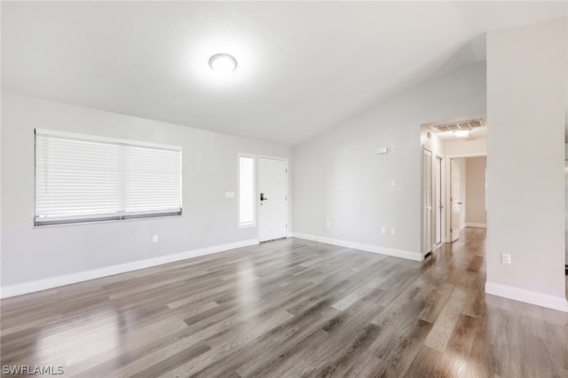 interior space featuring lofted ceiling and wood-type flooring