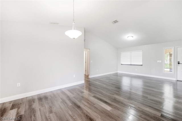 unfurnished living room with dark hardwood / wood-style floors and high vaulted ceiling