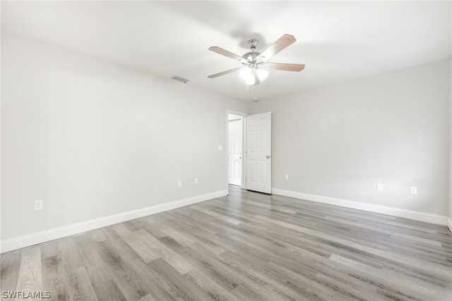 unfurnished room featuring light hardwood / wood-style flooring and ceiling fan