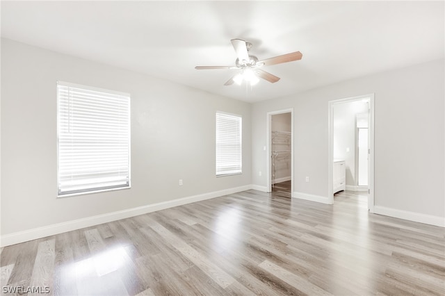 unfurnished room with light hardwood / wood-style floors and ceiling fan