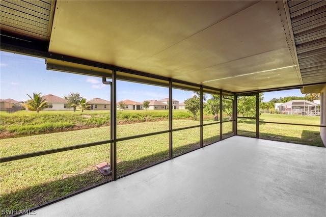 unfurnished sunroom featuring a healthy amount of sunlight