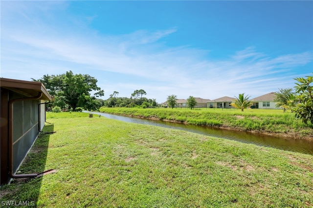 view of yard with a water view