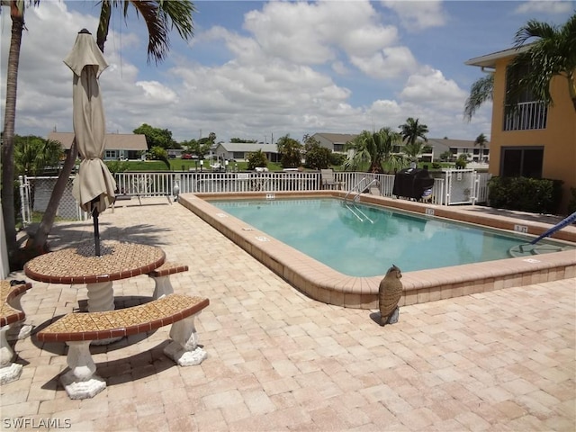 view of swimming pool featuring a patio