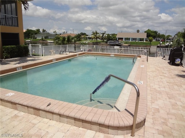 view of swimming pool featuring a patio