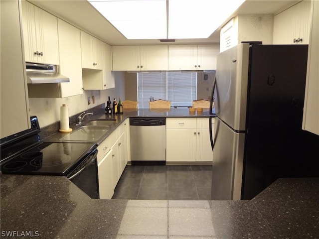 kitchen featuring sink, stainless steel appliances, white cabinetry, and extractor fan