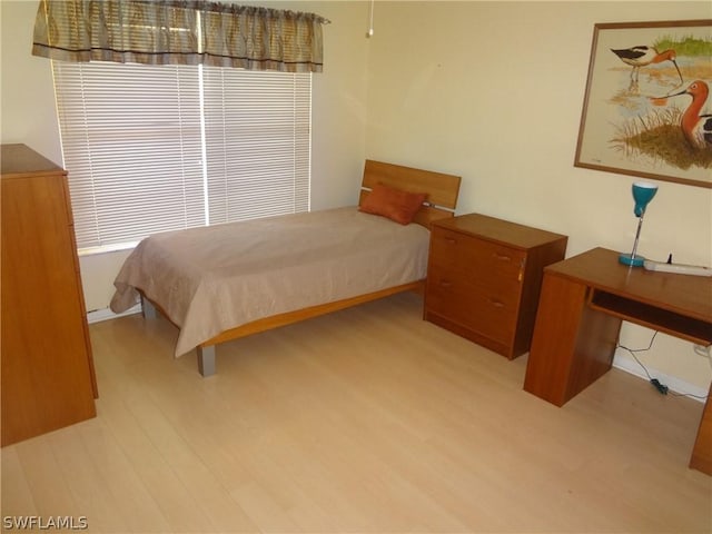 bedroom with light wood-type flooring