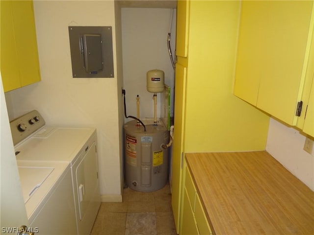 washroom with electric panel, light tile patterned floors, cabinets, electric water heater, and separate washer and dryer