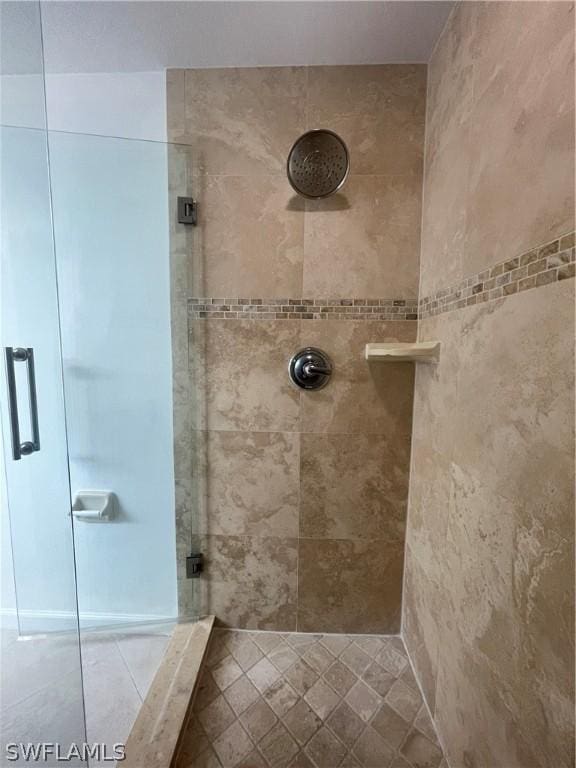 bathroom with tiled shower