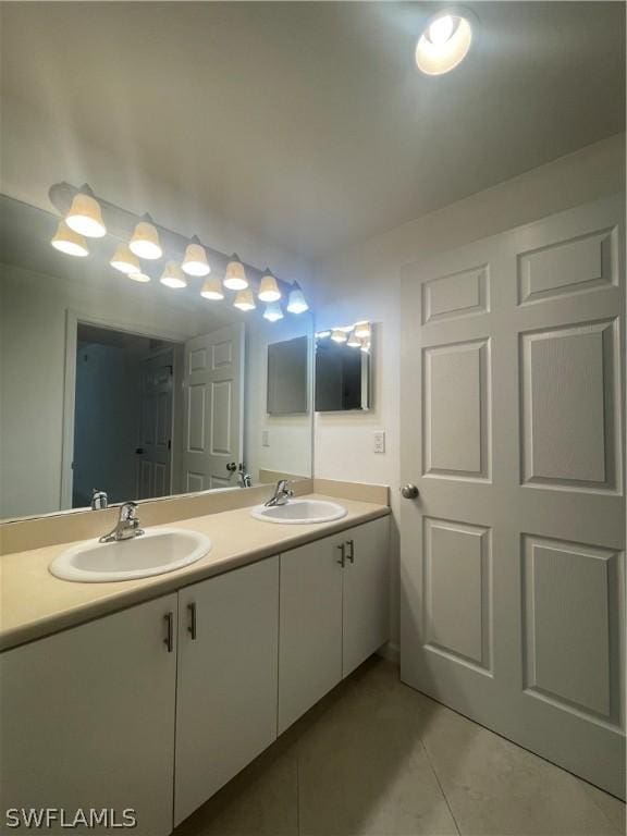 bathroom featuring tile patterned flooring and vanity