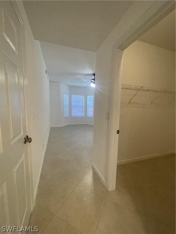 corridor with light tile patterned floors