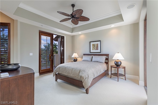 carpeted bedroom featuring crown molding, access to outside, ceiling fan, and a raised ceiling