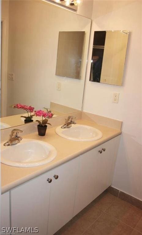 bathroom with tile patterned flooring and vanity