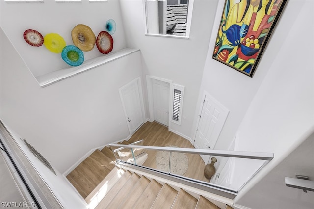 staircase featuring hardwood / wood-style flooring