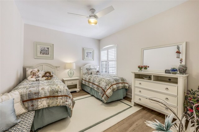 bedroom featuring ceiling fan and light hardwood / wood-style flooring