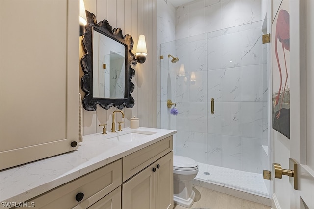 bathroom featuring vanity, toilet, and an enclosed shower