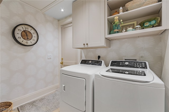 laundry room with cabinets and independent washer and dryer