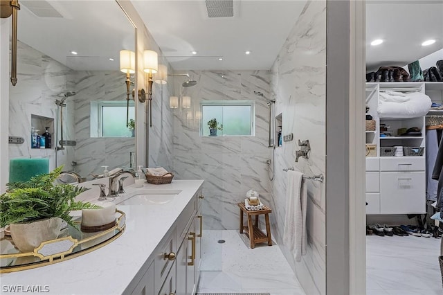 bathroom featuring vanity and an enclosed shower