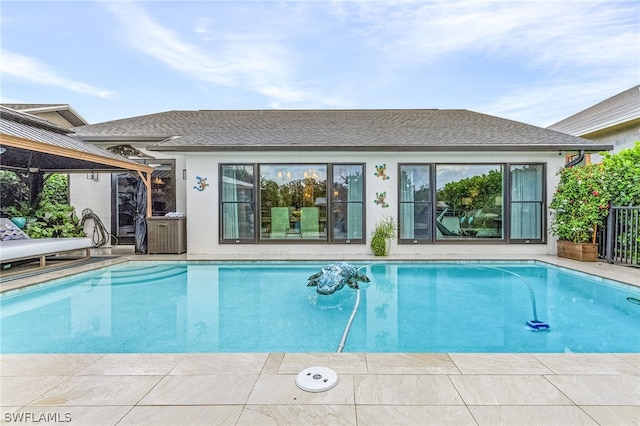 view of swimming pool with a patio area