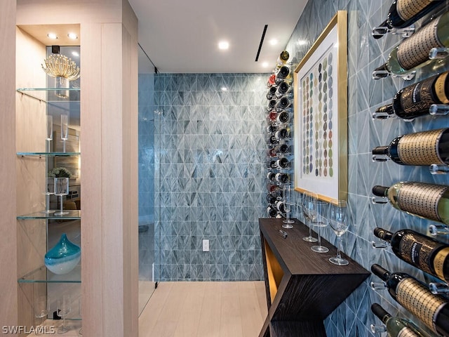 wine room featuring tile walls and tile patterned flooring